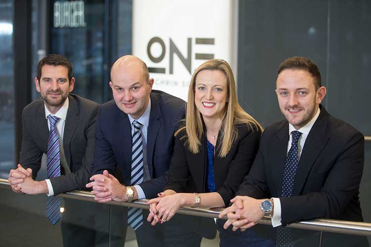 Senior Dealmakers at Anderson Anderson & Brown LLP, from left to right: Brian McMurray, Douglas Martin, Lyn Calder & Chris Thompson.